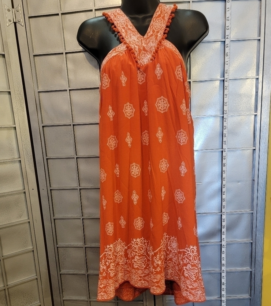 Loft medium orange top. Zipper back with shoulder straps with little pom poms.